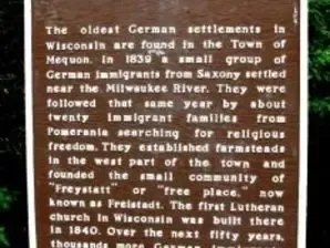 The brown Wisconsin's German Settlers historical marker describing the 1839 founding of Freistadt
