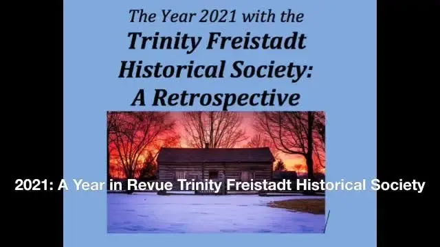 Title card for the 2021 Trinity Freistadt Historical Society retrospective, with the log cabin at sunset